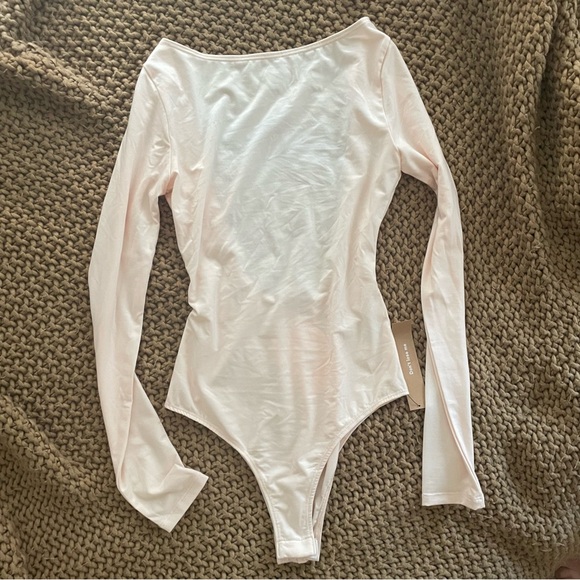 Reformation Tops - NWT light pink Reformation high-neck, open back body suit in size XS/0